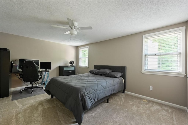 8 Apache Dr, Lake Winnebago, MO 64034 - bedroom with carpet floors, a textured ceiling, baseboards, an office area, and a ceiling fan