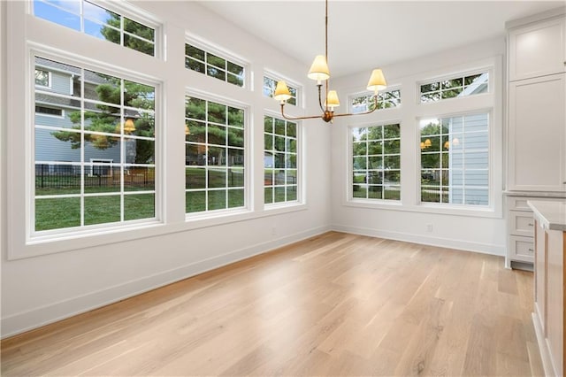 18568 W 180th Ct, Olathe, KS 66062 - unfurnished sunroom featuring a chandelier