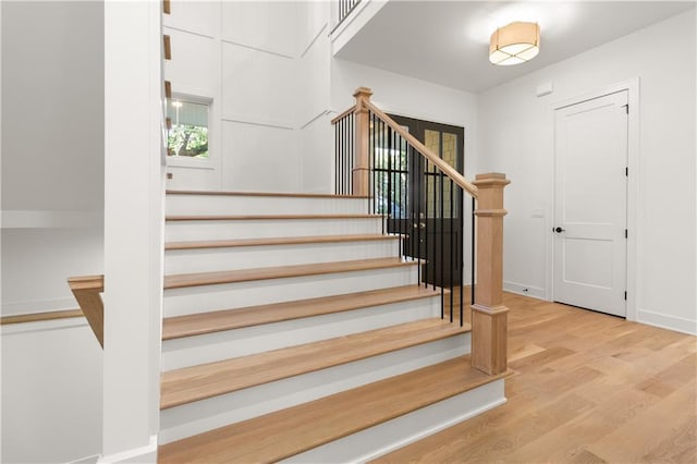 18568 W 180th Ct, Olathe, KS 66062 - staircase featuring wood finished floors and baseboards