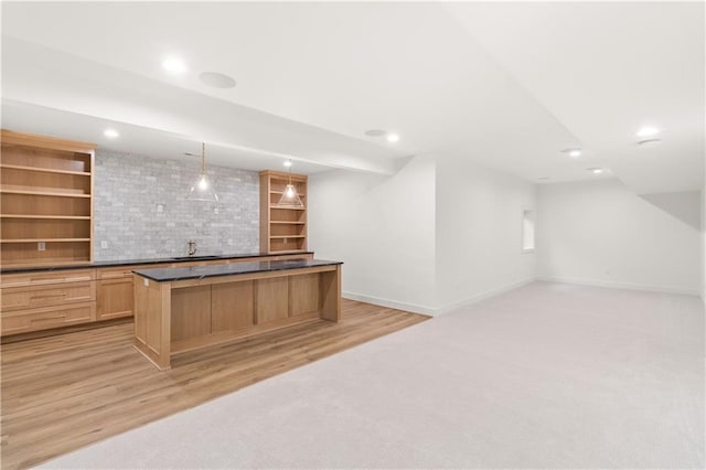 18568 W 180th Ct, Olathe, KS 66062 - bar area featuring baseboards, recessed lighting, light wood-style floors, a sink, and hanging light fixtures