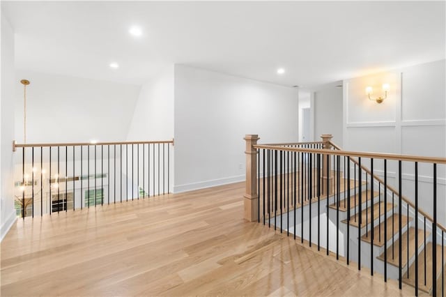 18568 W 180th Ct, Olathe, KS 66062 - hallway featuring wood finished floors, recessed lighting, and an upstairs landing