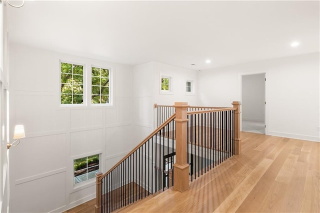 18568 W 180th Ct, Olathe, KS 66062 - stairway featuring wood finished floors, plenty of natural light, and recessed lighting