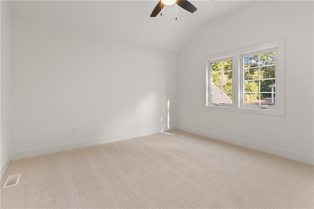 18568 W 180th Ct, Olathe, KS 66062 - empty room featuring light carpet, ceiling fan, vaulted ceiling, and baseboards