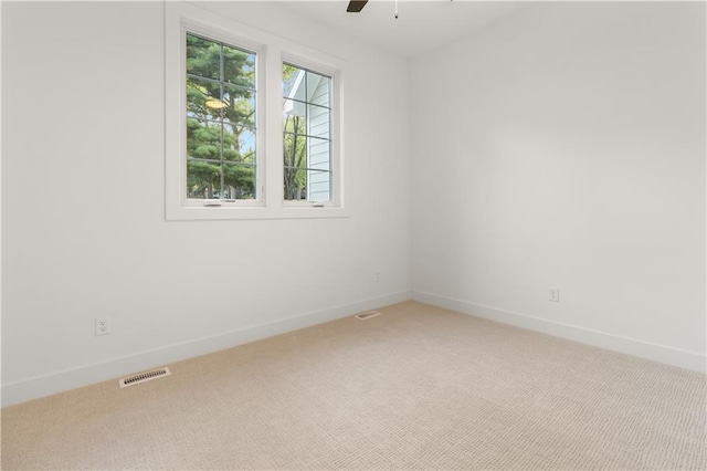 18568 W 180th Ct, Olathe, KS 66062 - empty room with light colored carpet, baseboards, and a ceiling fan