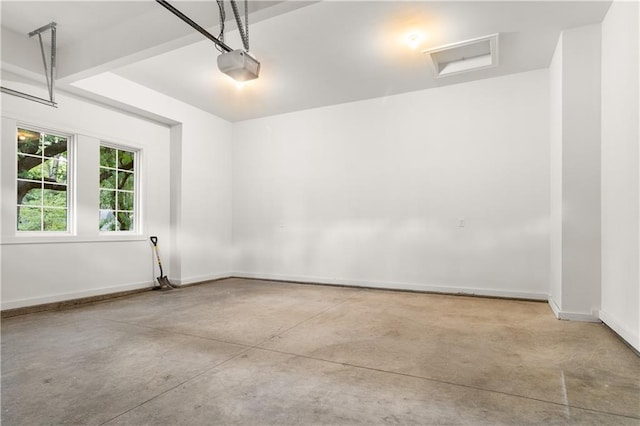18568 W 180th Ct, Olathe, KS 66062 - garage with a garage door opener and baseboards