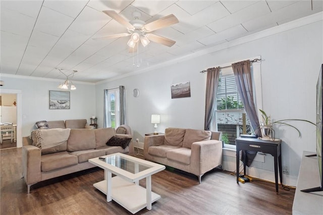 211 S 4th St, Fredonia, KS 66736 - living room featuring healthy amount of natural light, crown molding, wood finished floors, and a ceiling fan