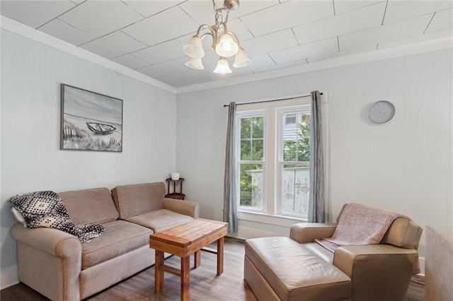 211 S 4th St, Fredonia, KS 66736 - living area featuring crown molding, wood finished floors, and a chandelier