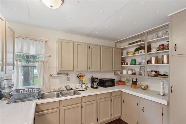 211 S 4th St, Fredonia, KS 66736 - kitchen with black microwave, a sink, light countertops, and open shelves