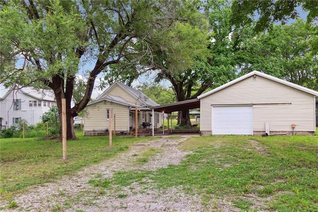 211 S 4th St, Fredonia, KS 66736 - garage featuring driveway and a garage