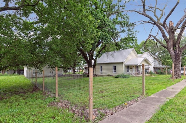 211 S 4th St, Fredonia, KS 66736 - view of side of home featuring metal roof