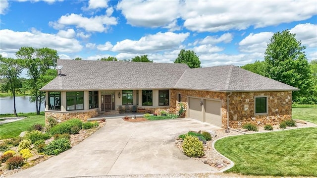 1672 N 1st Rd, Baldwin City, KS 66006 - ranch-style home featuring stone siding, an attached garage, a front lawn, concrete driveway, and a shingled roof