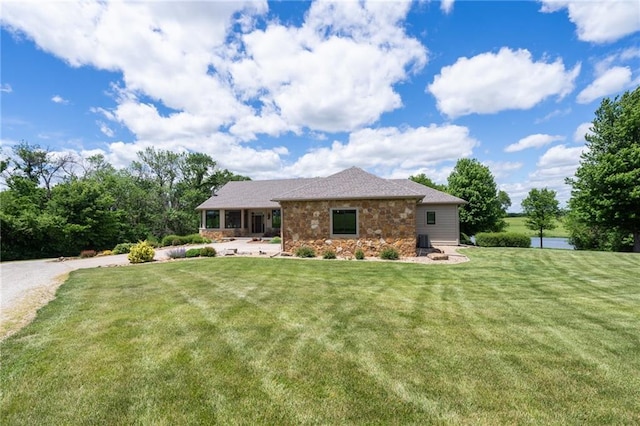 1672 N 1st Rd, Baldwin City, KS 66006 - view of front of house with stone siding and a front yard