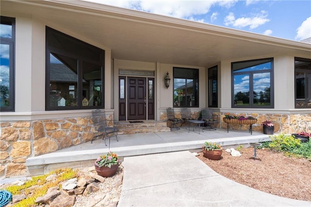 1672 N 1st Rd, Baldwin City, KS 66006 - view of exterior entry featuring stone siding and covered porch