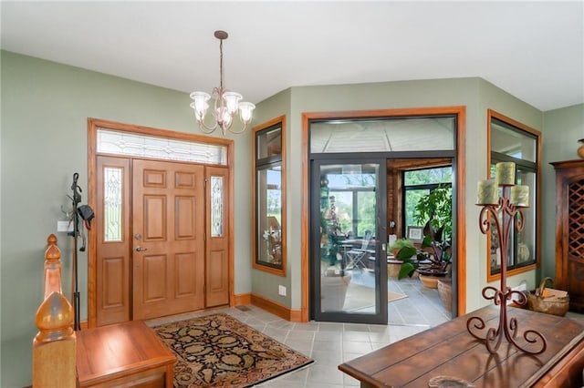 1672 N 1st Rd, Baldwin City, KS 66006 - entrance foyer featuring a chandelier, light tile patterned floors, and baseboards