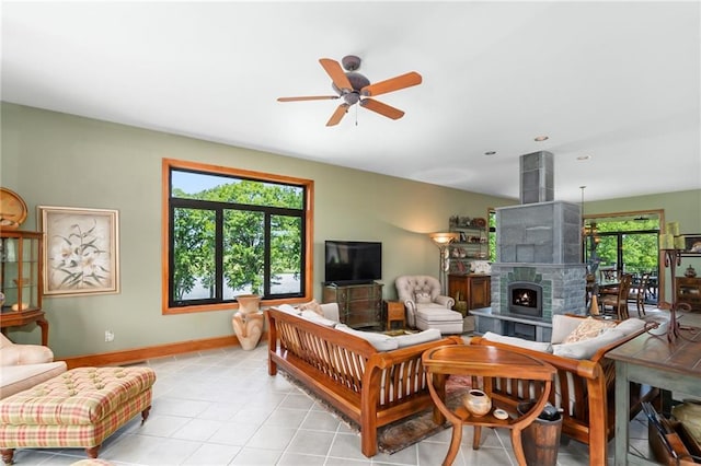 1672 N 1st Rd, Baldwin City, KS 66006 - living room featuring a ceiling fan, a tile fireplace, baseboards, and light tile patterned floors