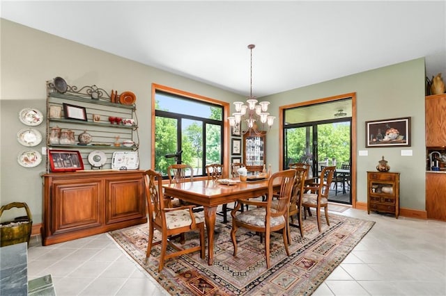 1672 N 1st Rd, Baldwin City, KS 66006 - dining space featuring a chandelier, light tile patterned flooring, and baseboards