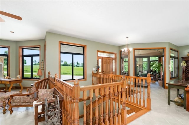 1672 N 1st Rd, Baldwin City, KS 66006 - staircase featuring plenty of natural light, tile patterned floors, a chandelier, a ceiling fan, and recessed lighting