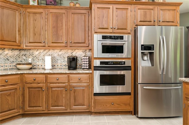1672 N 1st Rd, Baldwin City, KS 66006 - kitchen featuring stainless steel refrigerator with ice dispenser, decorative backsplash, brown cabinetry, and light stone counters