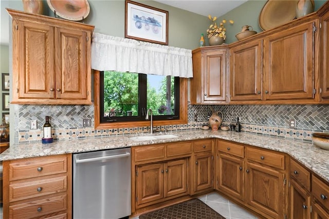 1672 N 1st Rd, Baldwin City, KS 66006 - kitchen featuring dishwasher, a sink, decorative backsplash, and brown cabinetry