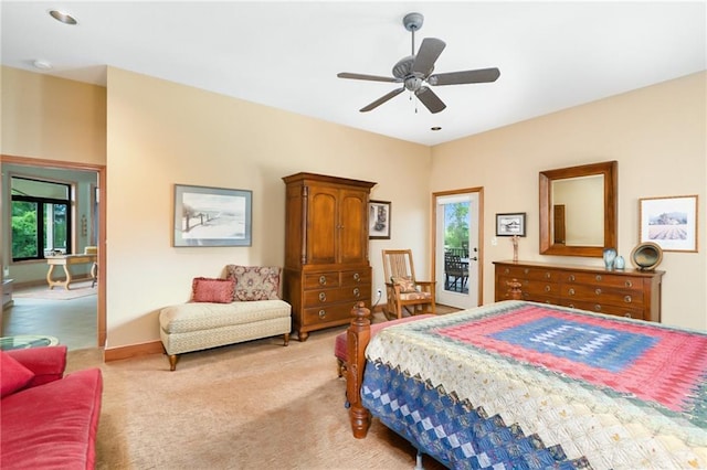 1672 N 1st Rd, Baldwin City, KS 66006 - bedroom featuring multiple windows, light colored carpet, ceiling fan, and baseboards