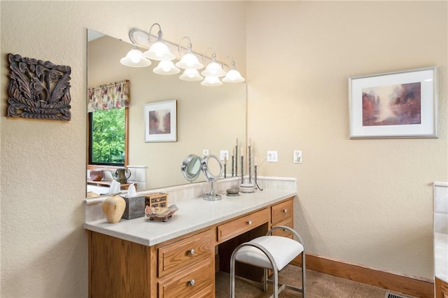 1672 N 1st Rd, Baldwin City, KS 66006 - bathroom with a textured wall, vanity, and baseboards