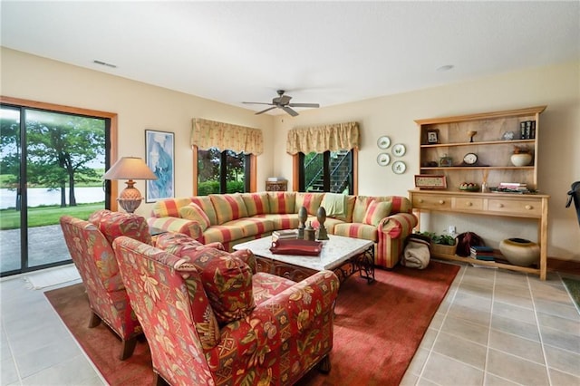 1672 N 1st Rd, Baldwin City, KS 66006 - living area featuring tile patterned flooring, healthy amount of natural light, and a ceiling fan