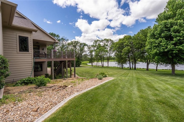 1672 N 1st Rd, Baldwin City, KS 66006 - view of green lawn with stairs and a deck with water view