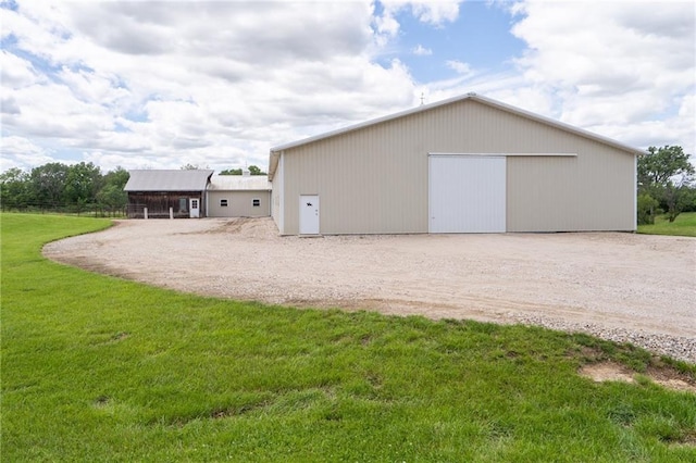 1672 N 1st Rd, Baldwin City, KS 66006 - detached garage featuring driveway