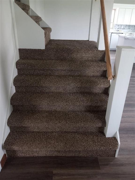 806 US Hwy, Iola, KS 66749 - staircase featuring wood finished floors