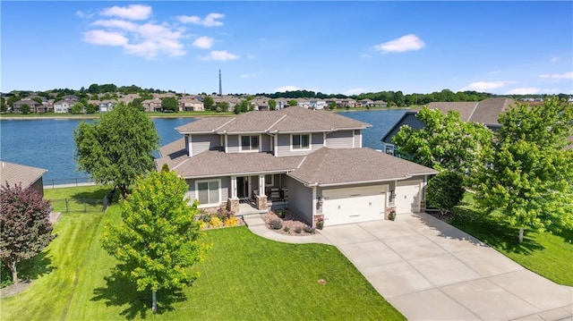 8909 SE 1st St, Blue Springs, MO 64064 - traditional home with a garage, a porch, driveway, roof with shingles, and a water view