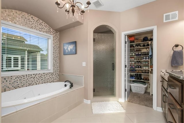 8909 SE 1st St, Blue Springs, MO 64064 - full bath featuring a stall shower, a jetted tub, a chandelier, a spacious closet, and vanity