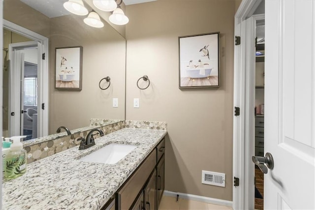 8909 SE 1st St, Blue Springs, MO 64064 - bathroom with vanity and baseboards
