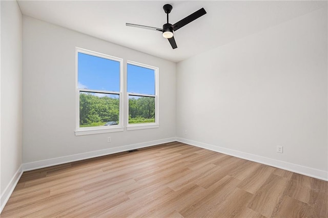 6932 Kenton St, Shawnee, KS 66226 - unfurnished room with light wood-style floors and ceiling fan