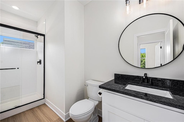 6932 Kenton St, Shawnee, KS 66226 - full bathroom featuring vanity, a shower stall, and wood finished floors