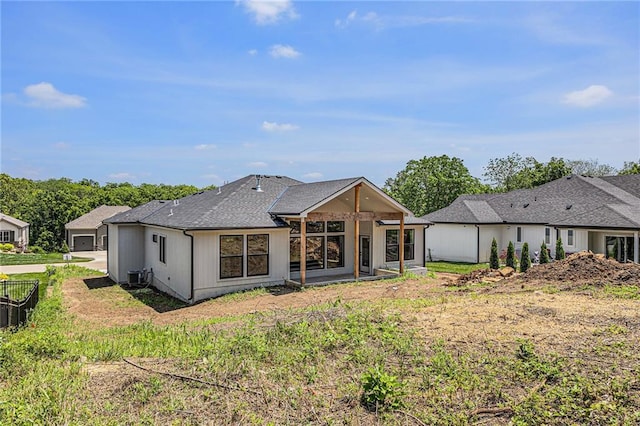 6932 Kenton St, Shawnee, KS 66226 - back of property with a shingled roof