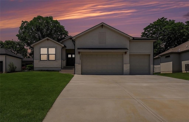 6932 Kenton St, Shawnee, KS 66226 - single story home featuring driveway, an attached garage, a front lawn, and stucco siding