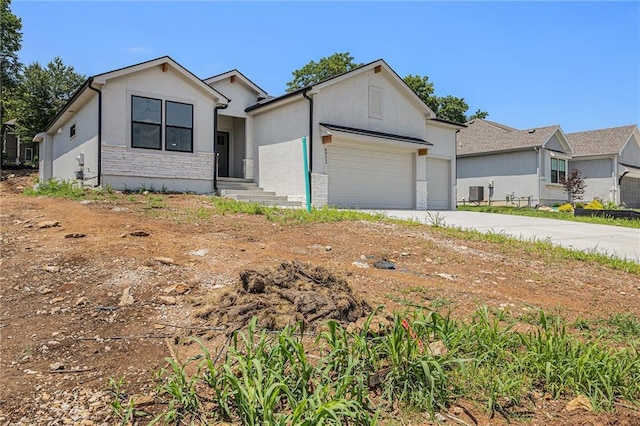 6932 Kenton St, Shawnee, KS 66226 - single story home with an attached garage, concrete driveway, and stucco siding