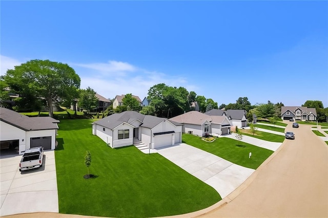 6932 Kenton St, Shawnee, KS 66226 - view of front of house with a residential view, driveway, and a front yard