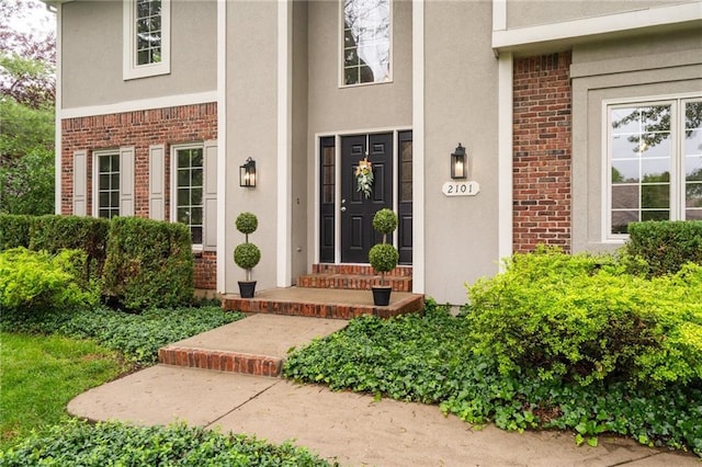 2101 Riviera Dr, Lawrence, KS 66047 - property entrance featuring brick siding and stucco siding