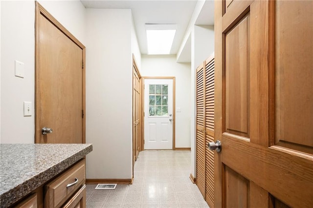 2101 Riviera Dr, Lawrence, KS 66047 - corridor featuring baseboards and light flooring