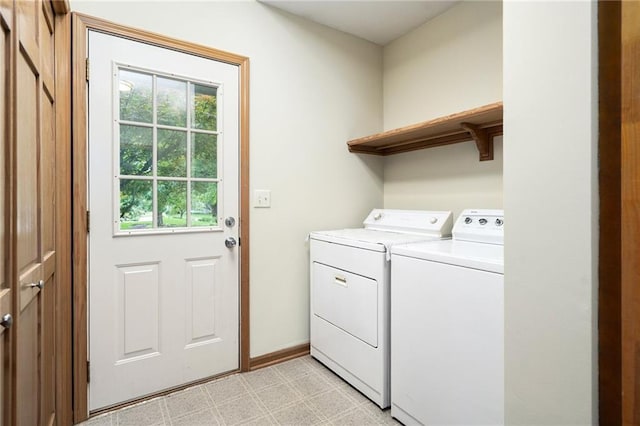 2101 Riviera Dr, Lawrence, KS 66047 - washroom with washer and clothes dryer, light floors, and baseboards