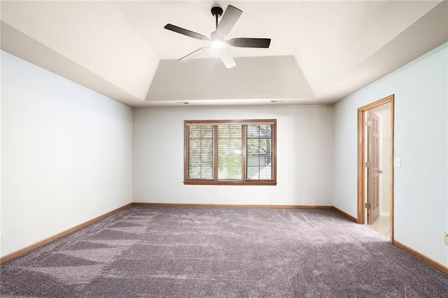 2101 Riviera Dr, Lawrence, KS 66047 - carpeted empty room featuring a raised ceiling, a ceiling fan, and baseboards