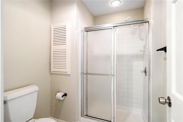 2101 Riviera Dr, Lawrence, KS 66047 - bathroom featuring toilet and a shower stall