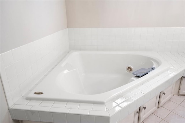 2101 Riviera Dr, Lawrence, KS 66047 - bathroom featuring a whirlpool tub and tile patterned floors