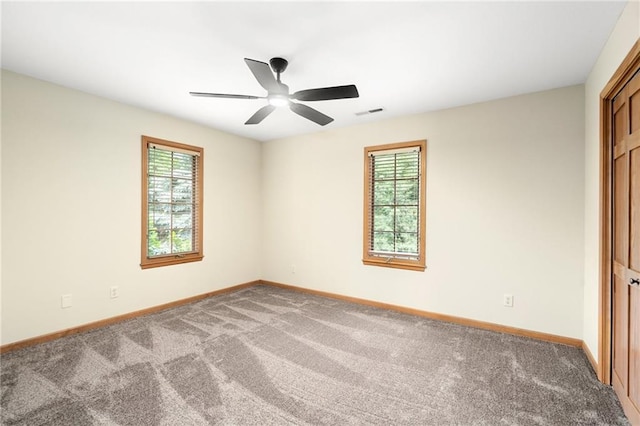 2101 Riviera Dr, Lawrence, KS 66047 - carpeted spare room featuring baseboards and a ceiling fan