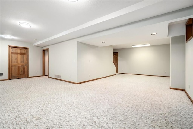 2101 Riviera Dr, Lawrence, KS 66047 - finished below grade area featuring light carpet, baseboards, and recessed lighting