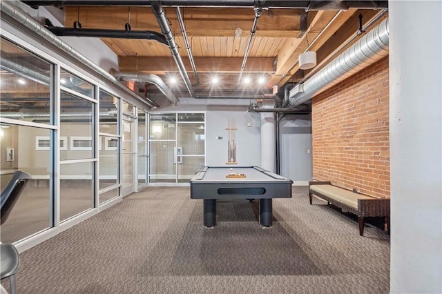 712 Broadway Blvd Unit 607, Kansas City, MO 64105 - recreation room featuring brick wall, carpet floors, and billiards