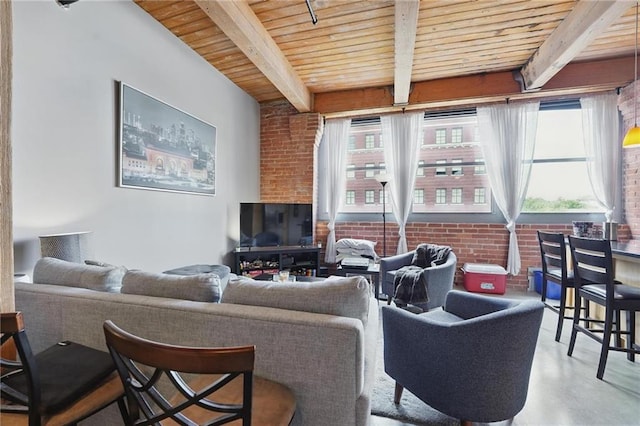 712 Broadway Blvd Unit 607, Kansas City, MO 64105 - living room featuring wood ceiling with exposed beams, plenty of natural light, brick wall, and finished concrete floors