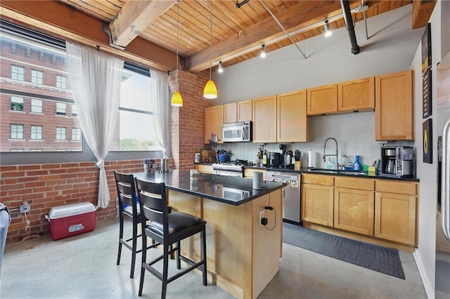 712 Broadway Blvd Unit 607, Kansas City, MO 64105 - kitchen featuring appliances with stainless steel finishes, a sink, concrete floors, dark countertops, and wood ceiling with exposed beams