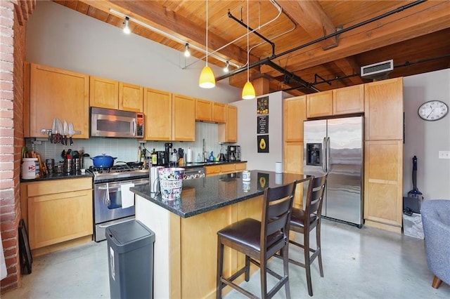 712 Broadway Blvd Unit 607, Kansas City, MO 64105 - kitchen with stainless steel appliances, finished concrete flooring, a breakfast bar, wood ceiling with exposed beams, and a center island